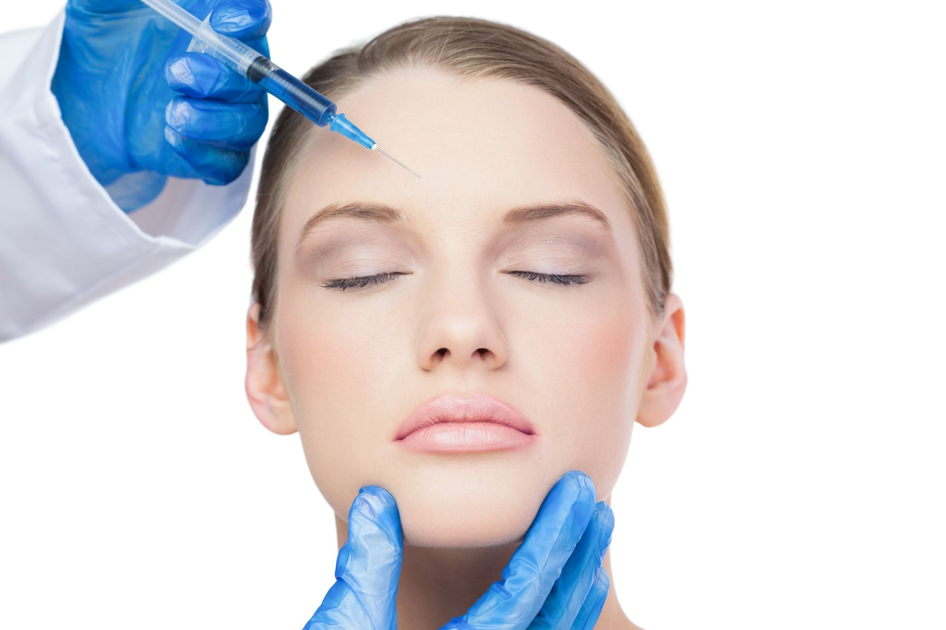 A woman is getting a botox injection in her forehead.