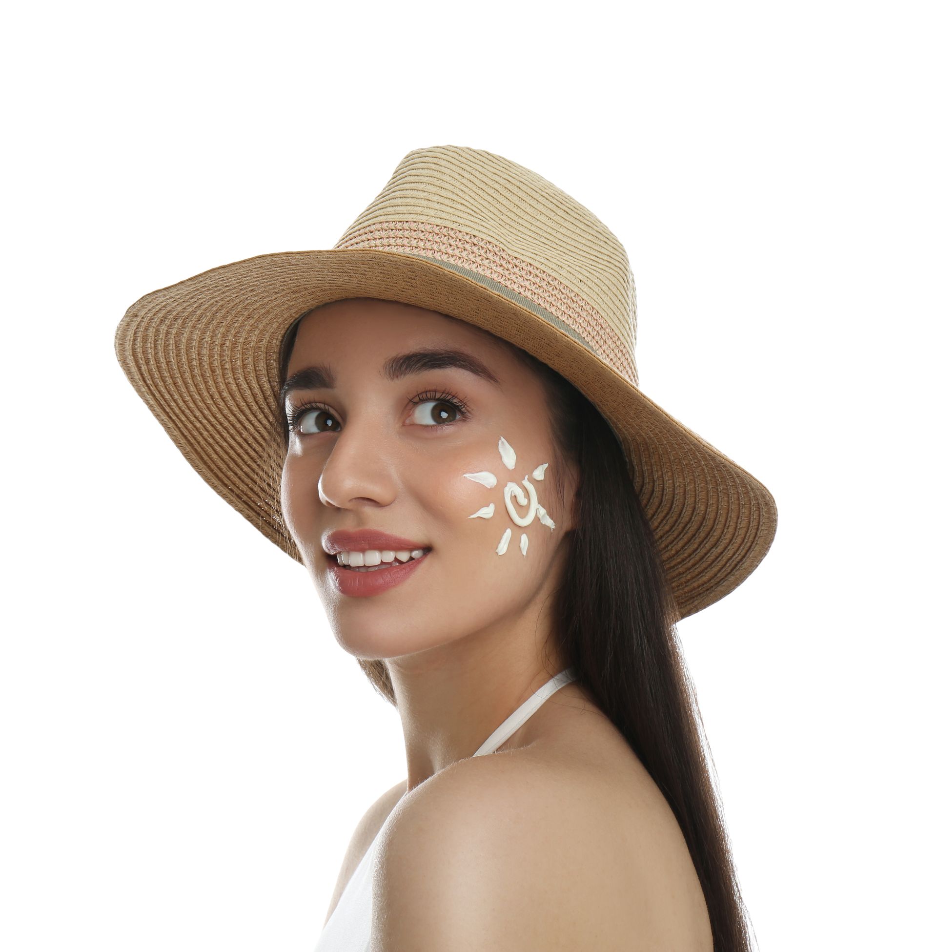 A woman wearing a hat has a sun painted on her face.