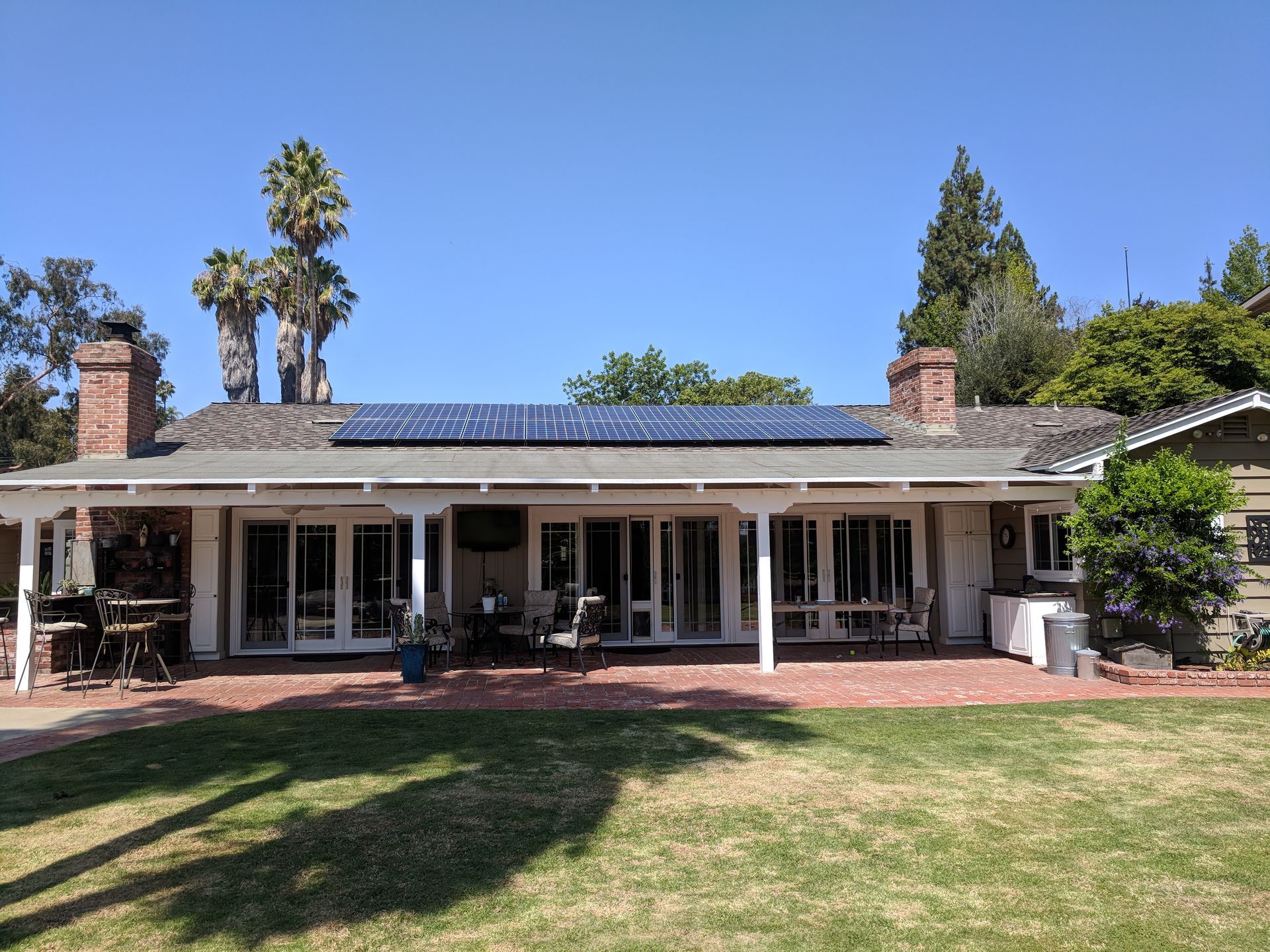 A large house with solar panels on the roof