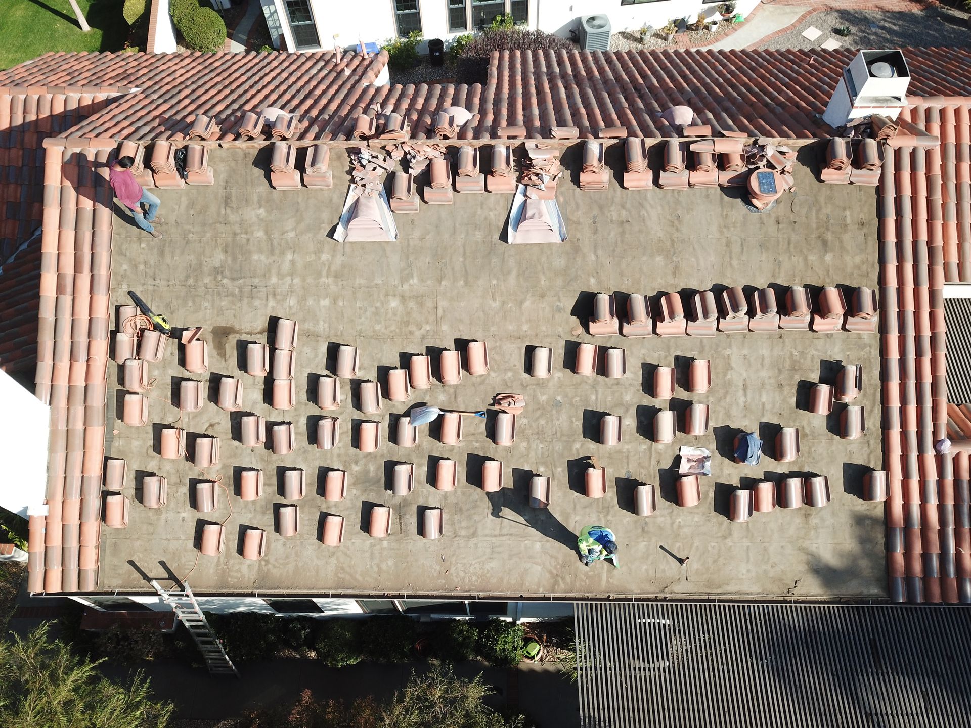 An aerial view of a roof with a lot of bricks on it