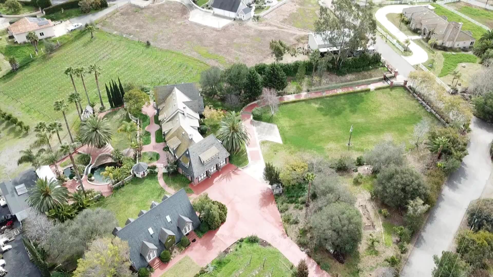 An aerial view of a residential area with lots of houses and trees