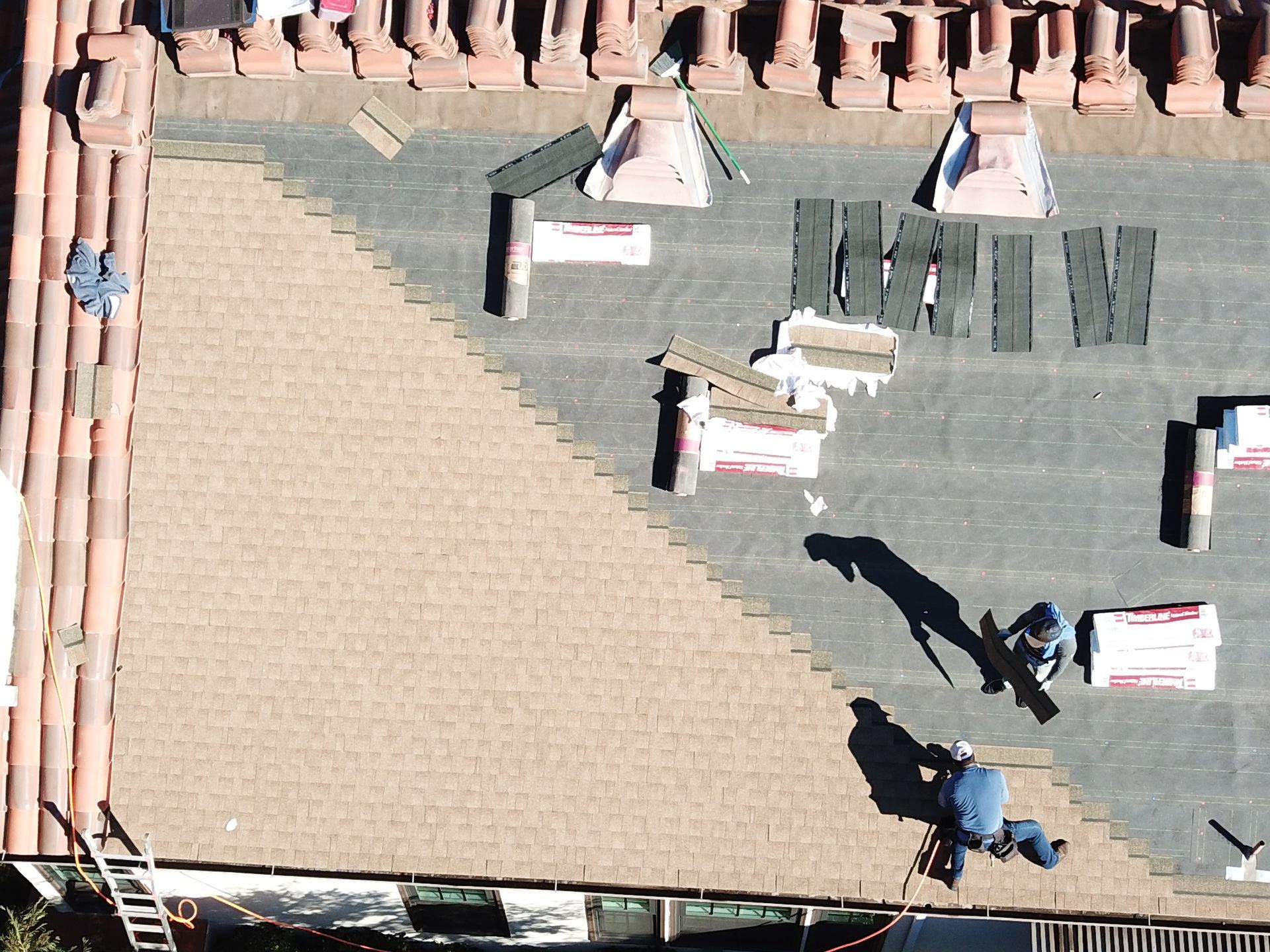 An aerial view of a roof being installed