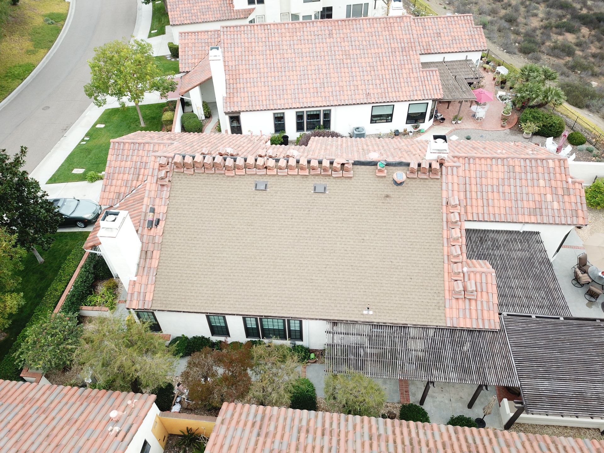 An aerial view of a house with a tiled roof