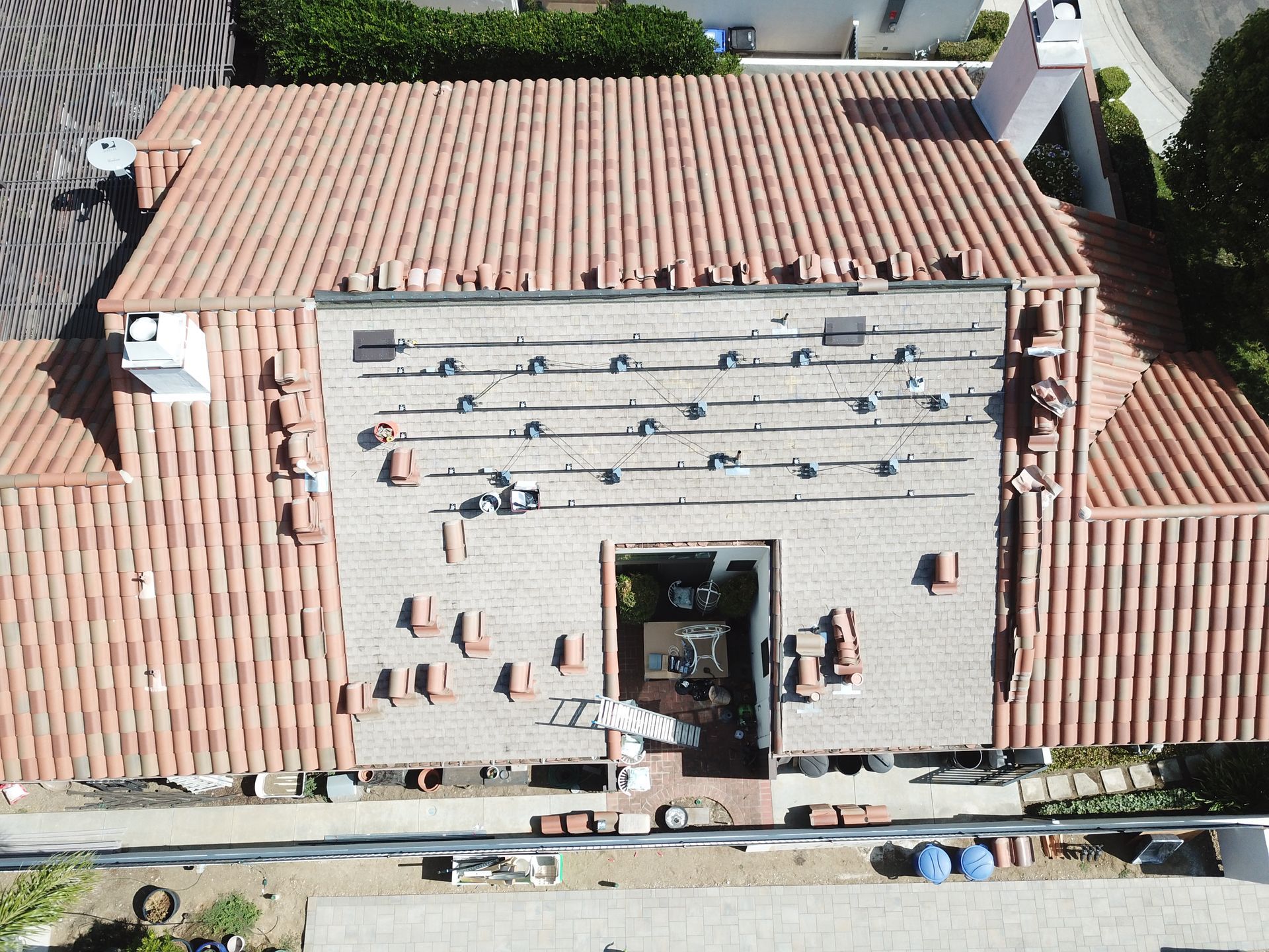 An aerial view of a house with a tiled roof