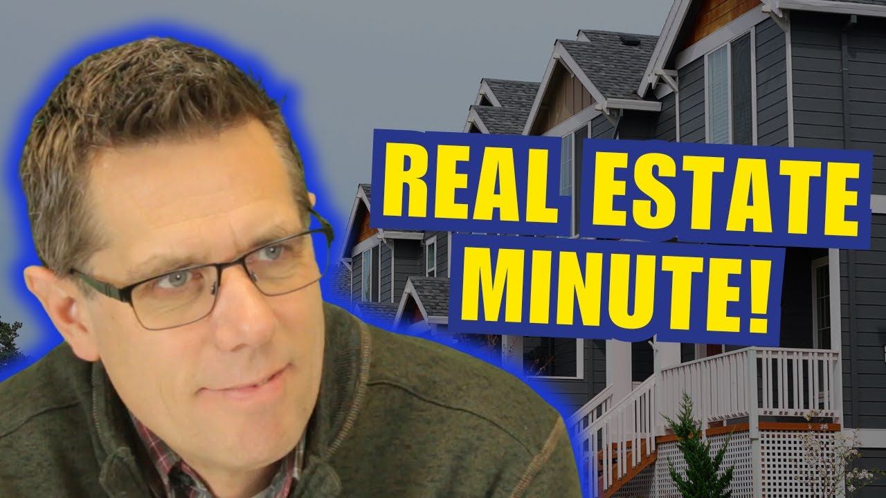 a man wearing glasses is standing in front of a sign that says real estate minute . market trends