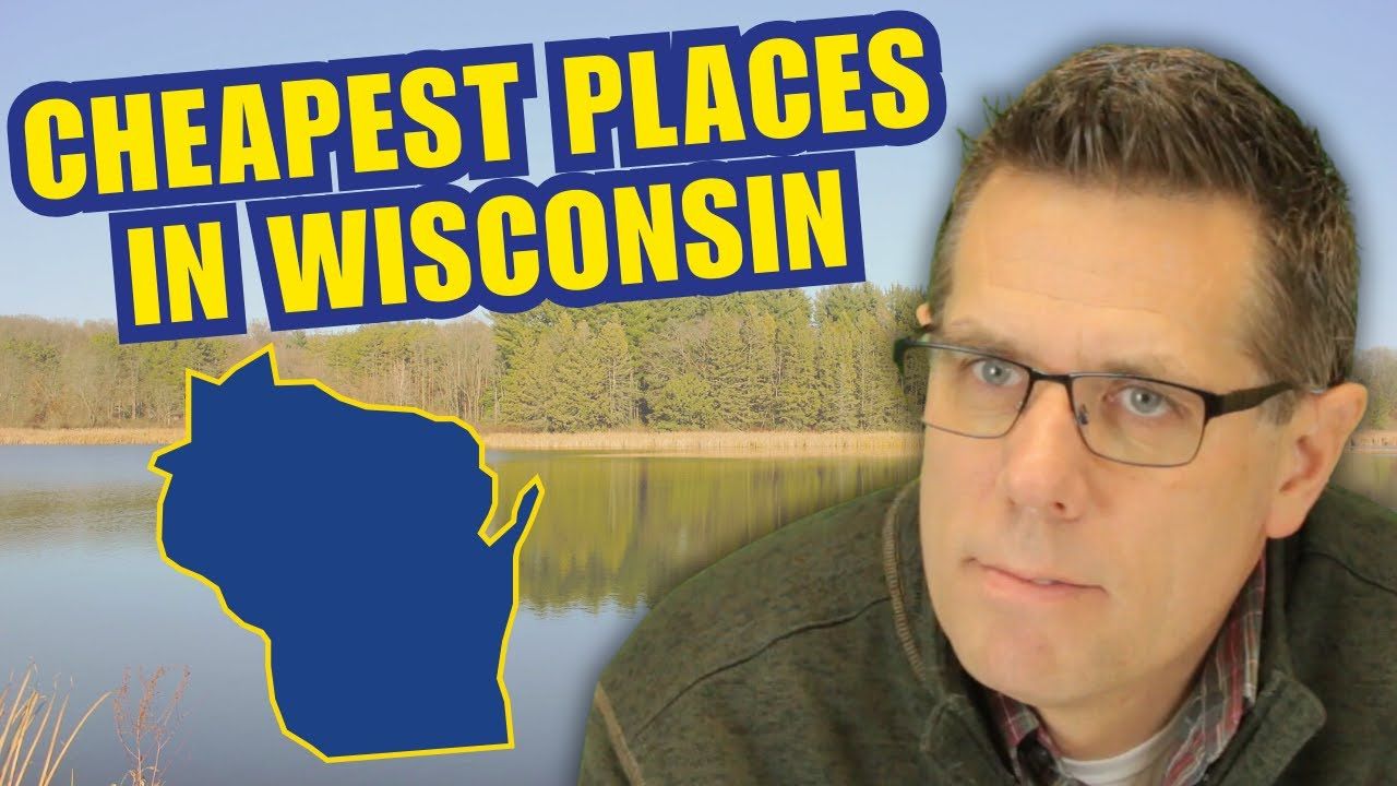 a man wearing glasses is standing in front of a map of wisconsin . cheapest places to live in WI