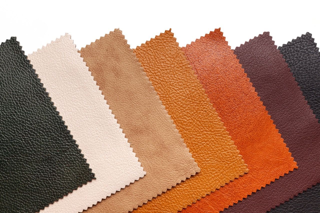 Samples of various colored leather swatches arranged diagonally.