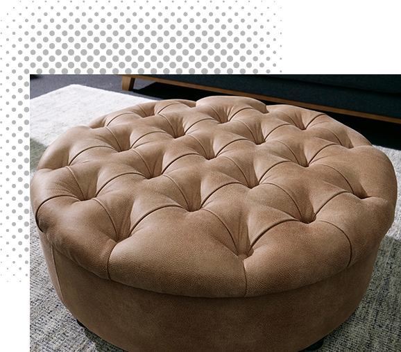 Tufted, round brown ottoman.