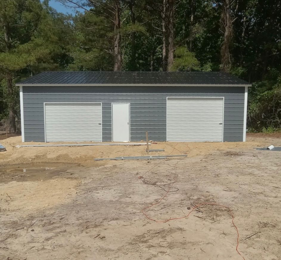 Carport with trees behind - Asheboro, NC | Ciro's Carports & More LLC