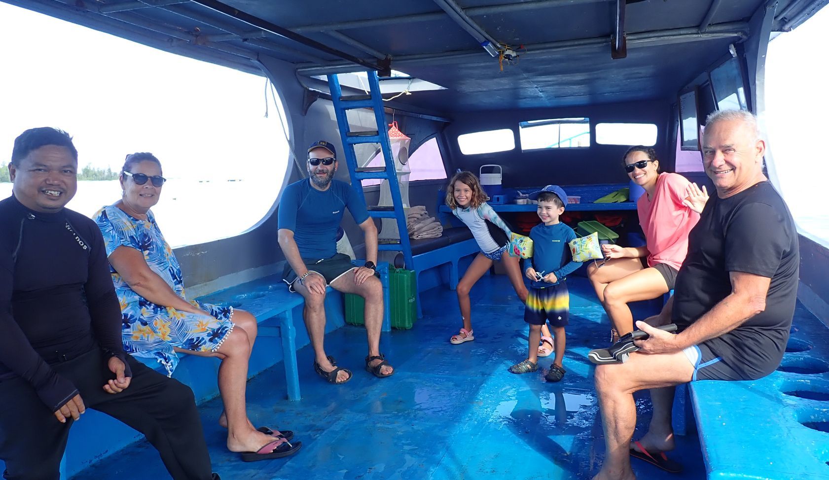 A group of people are sitting on a boat.