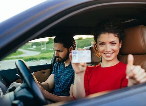 Woman Holding Drivers License — Auburn, WA — Auburn License Agency, Inc.