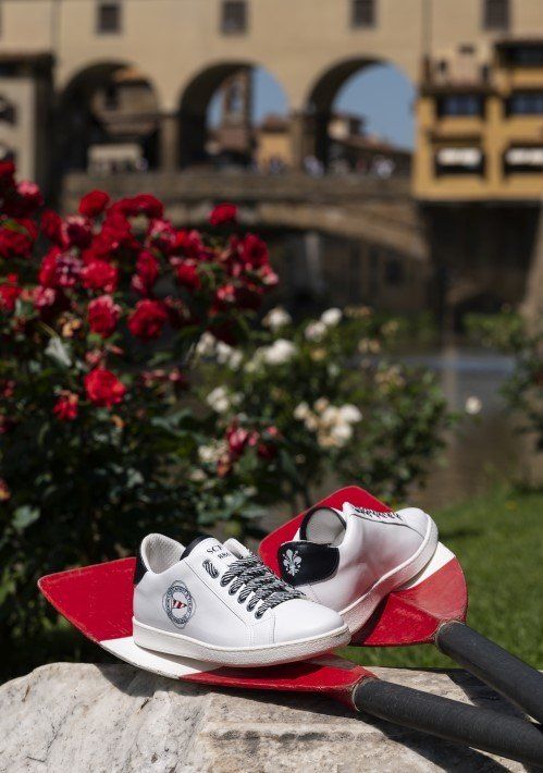 shoes of the rowing company of Florence with background of Ponte Vecchio