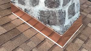 picture of copper base flashing on stone chimney