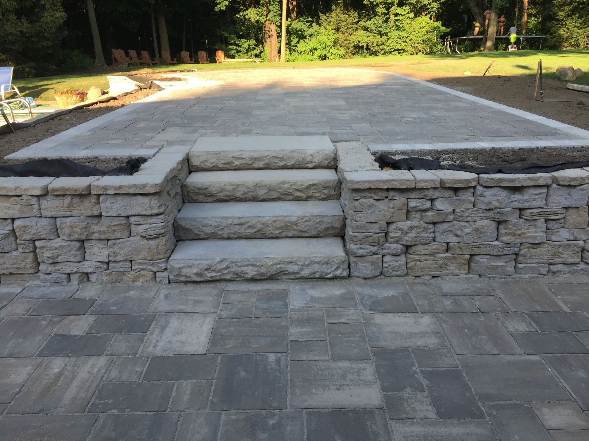Outdoor Living space with paver patio and steps