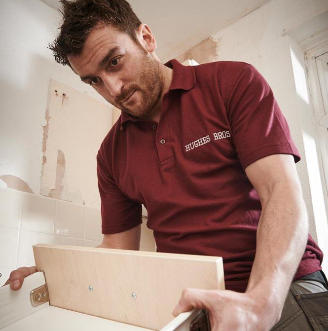 Employee working on new kitchens & bathrooms in The Wigan Borough