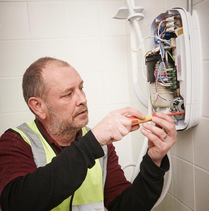 Employee working on new kitchens & bathrooms in The Wigan Borough