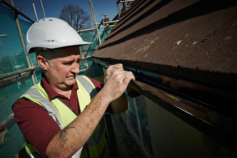 Experienced professional providing gutter repairing services