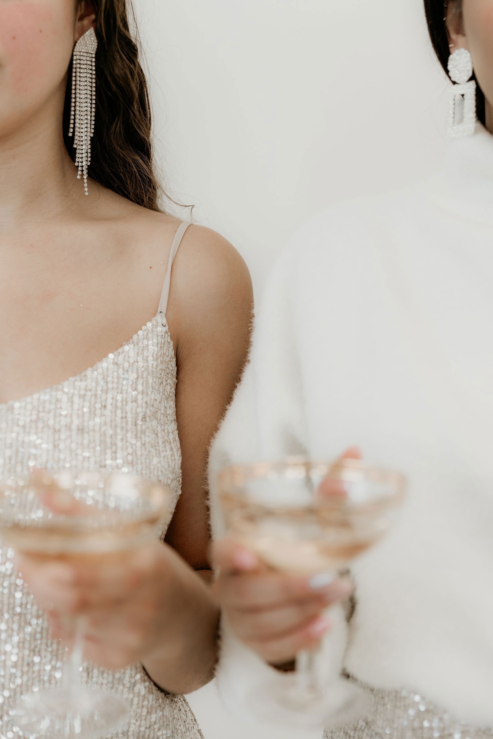 Social Soirees - Long table set for a formal dinner with red and black accents, floral centerpieces, and city skyline views.