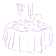 A table set for a special occasion with flowers, cake, and candles.