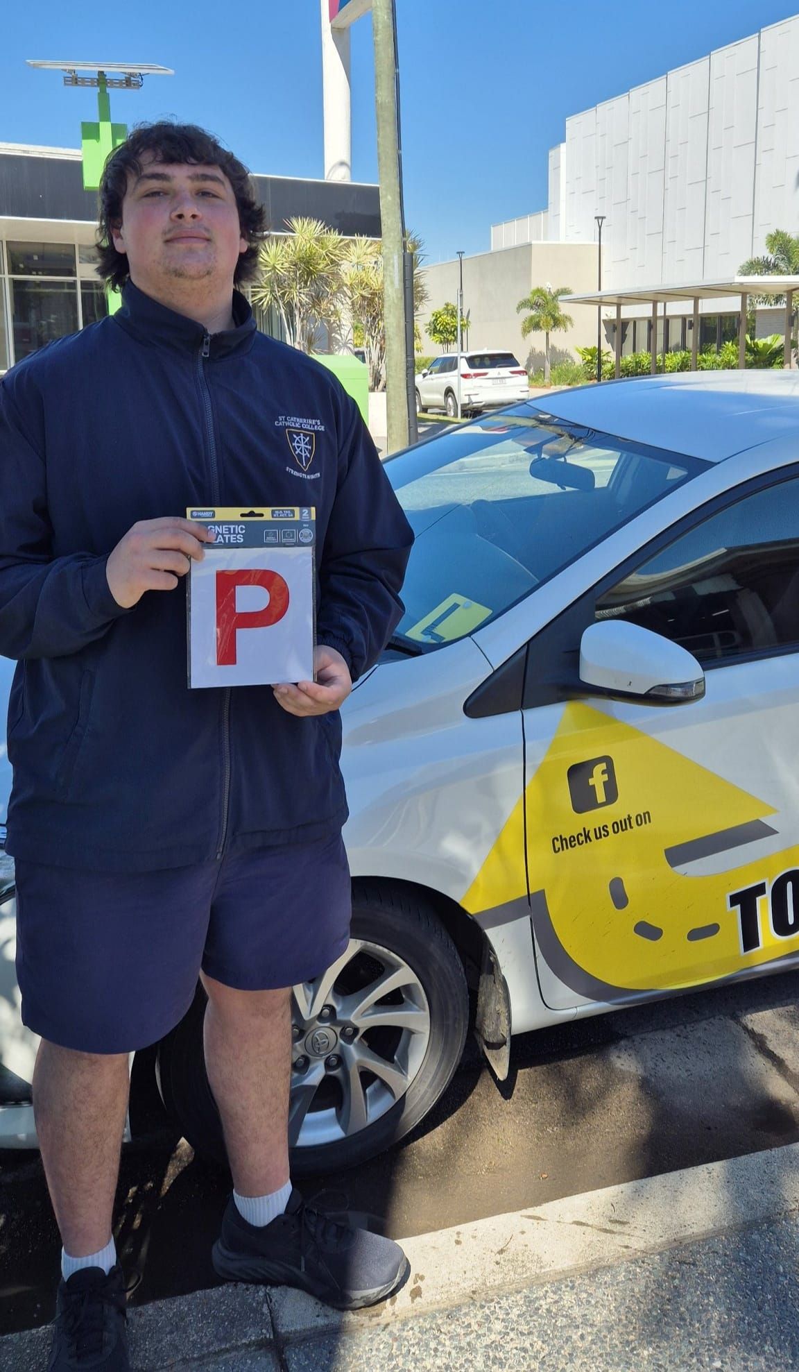 Young Person Holding a P Plate — Top Start Driving School (Whitsunday) In Airlie Beach, QLD