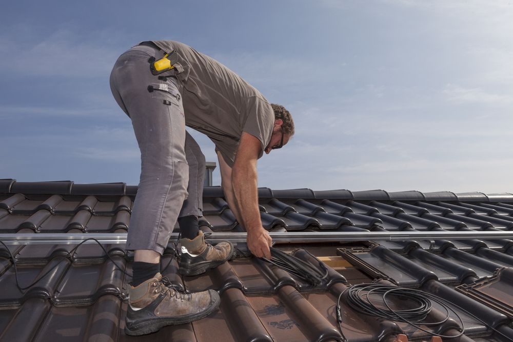 Worker Preparing The Roof to install Solar Panels — Roof Safety Systems in Castle Hill, NSW