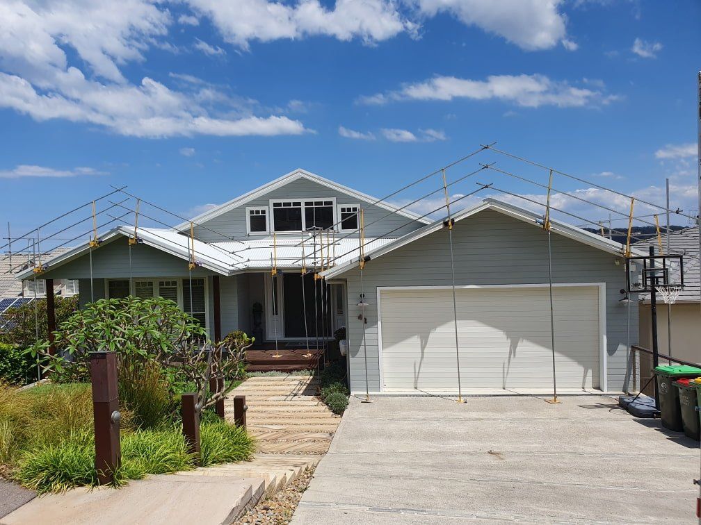 Gray House With Fences — Roof Safety Systems in Hunter Valley, NSW