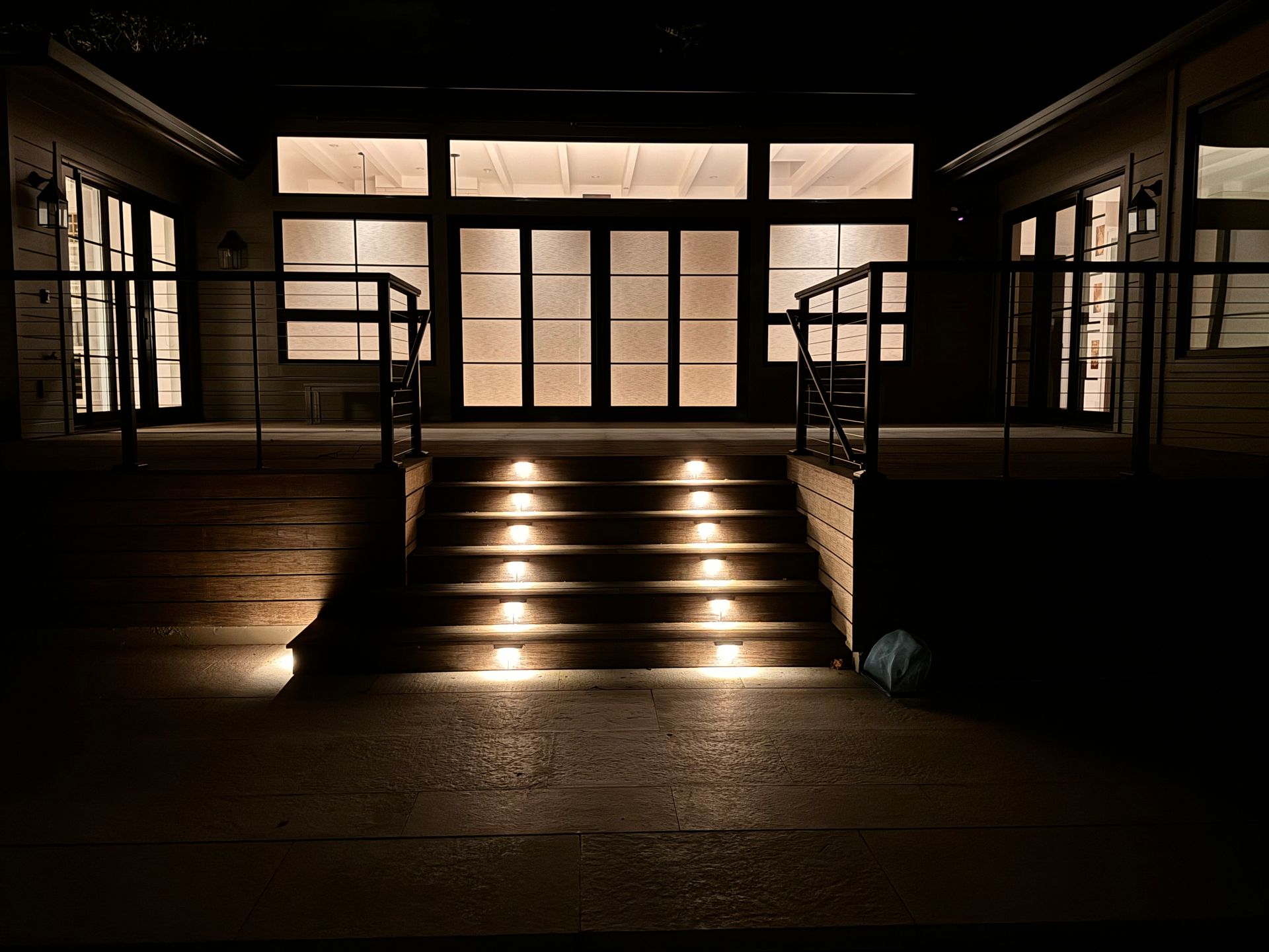 Stairs leading up to a building with lights on them