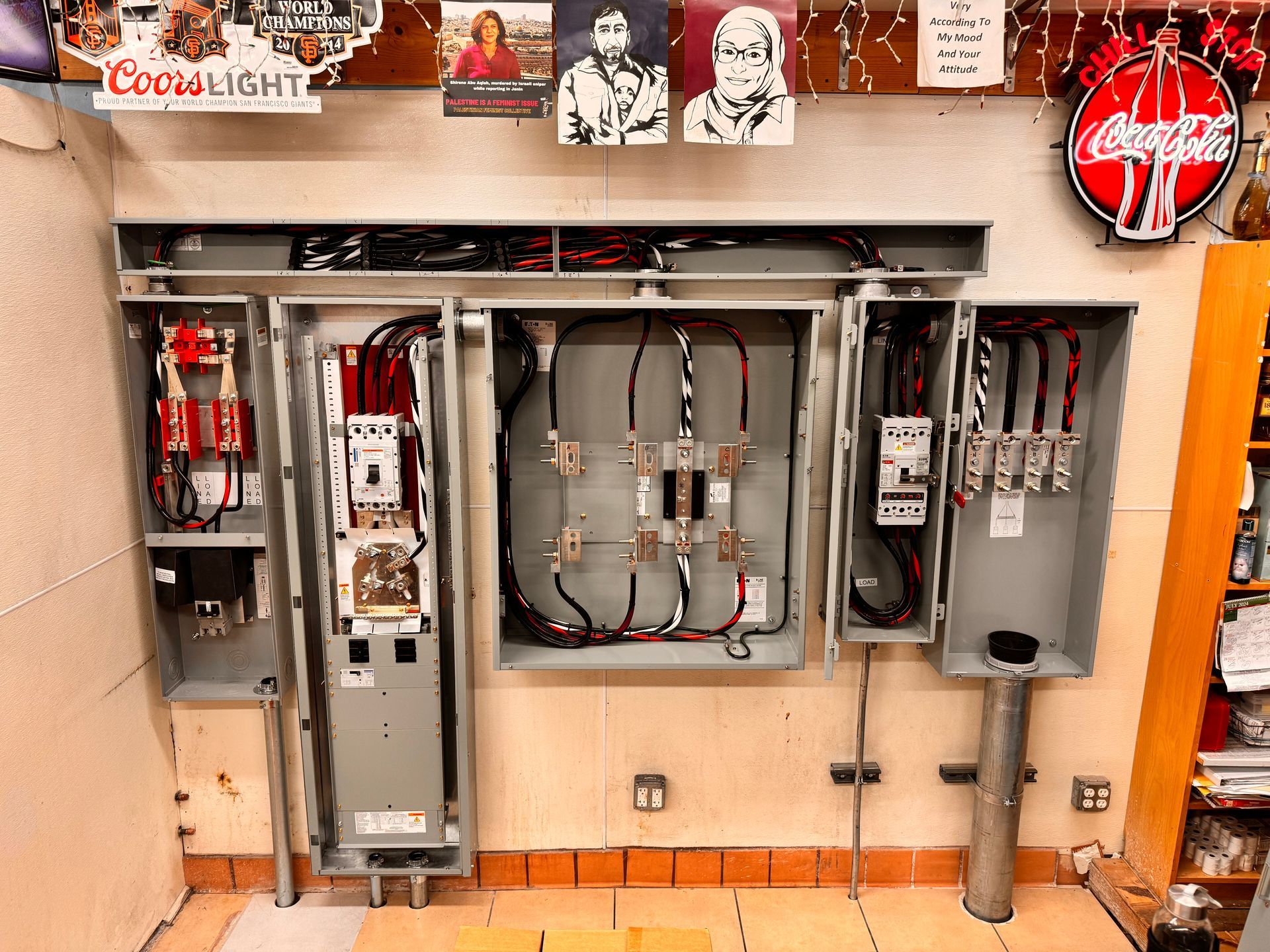 A room with a lot of electrical boxes on the wall.