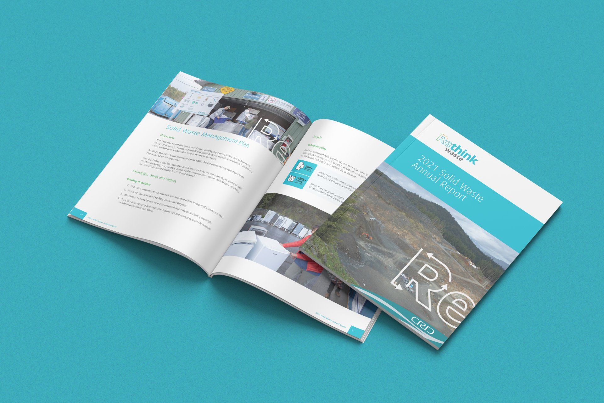 Two brochures are sitting on top of each other on a blue surface.