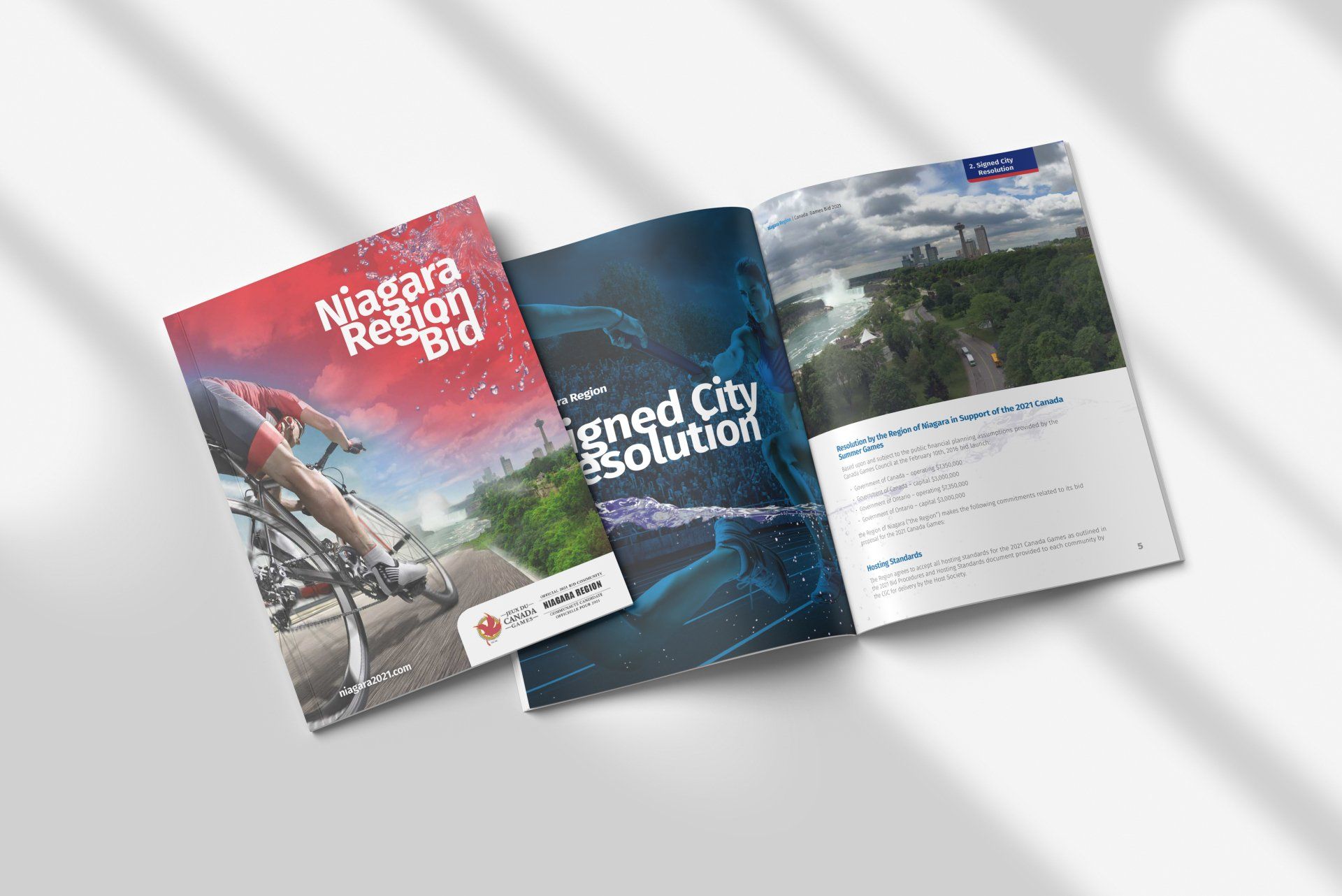 A book is open to a page with a picture of a person riding a bike on it.