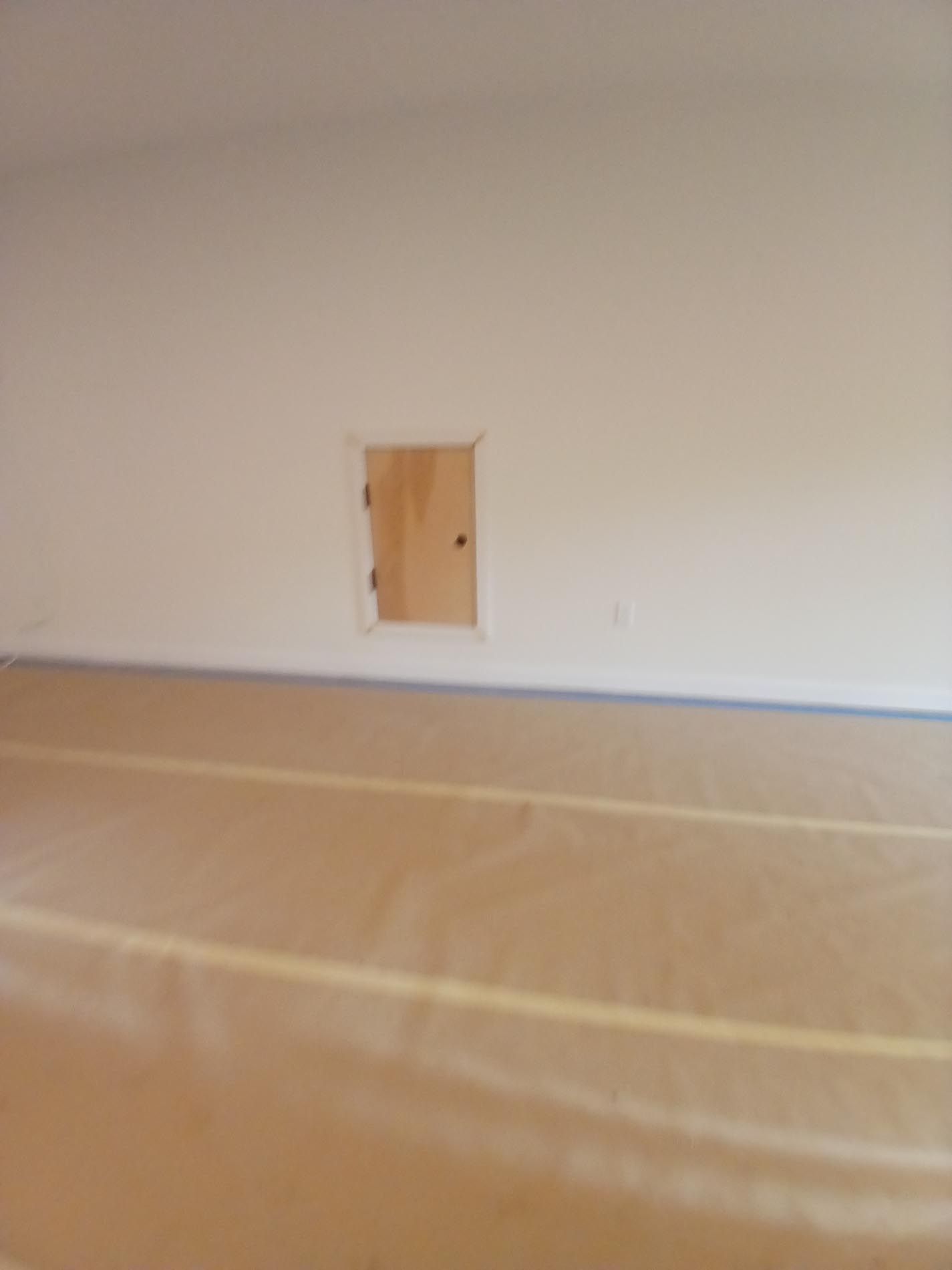 An empty room with a door in the wall