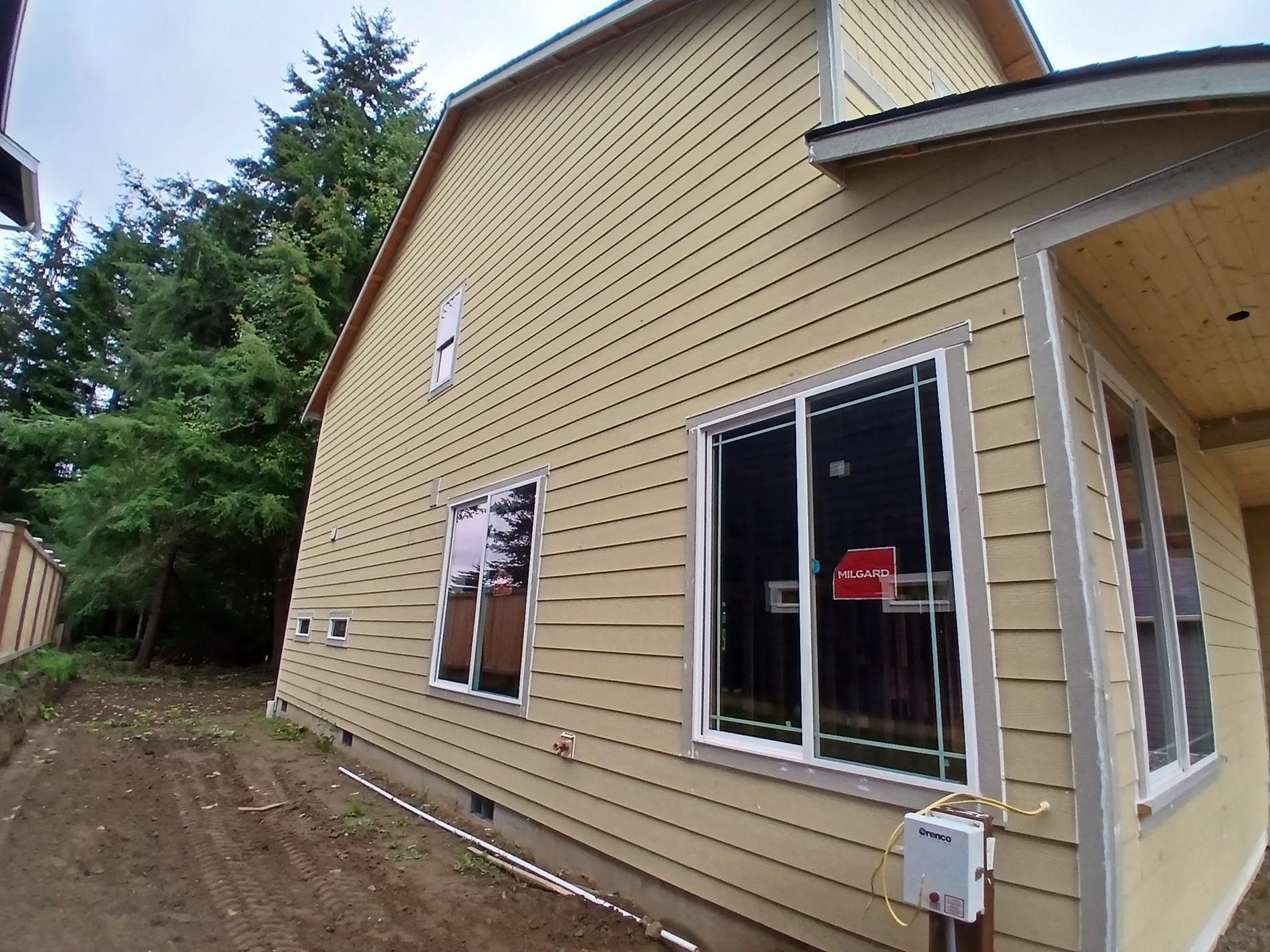 A house with a lot of windows is being built
