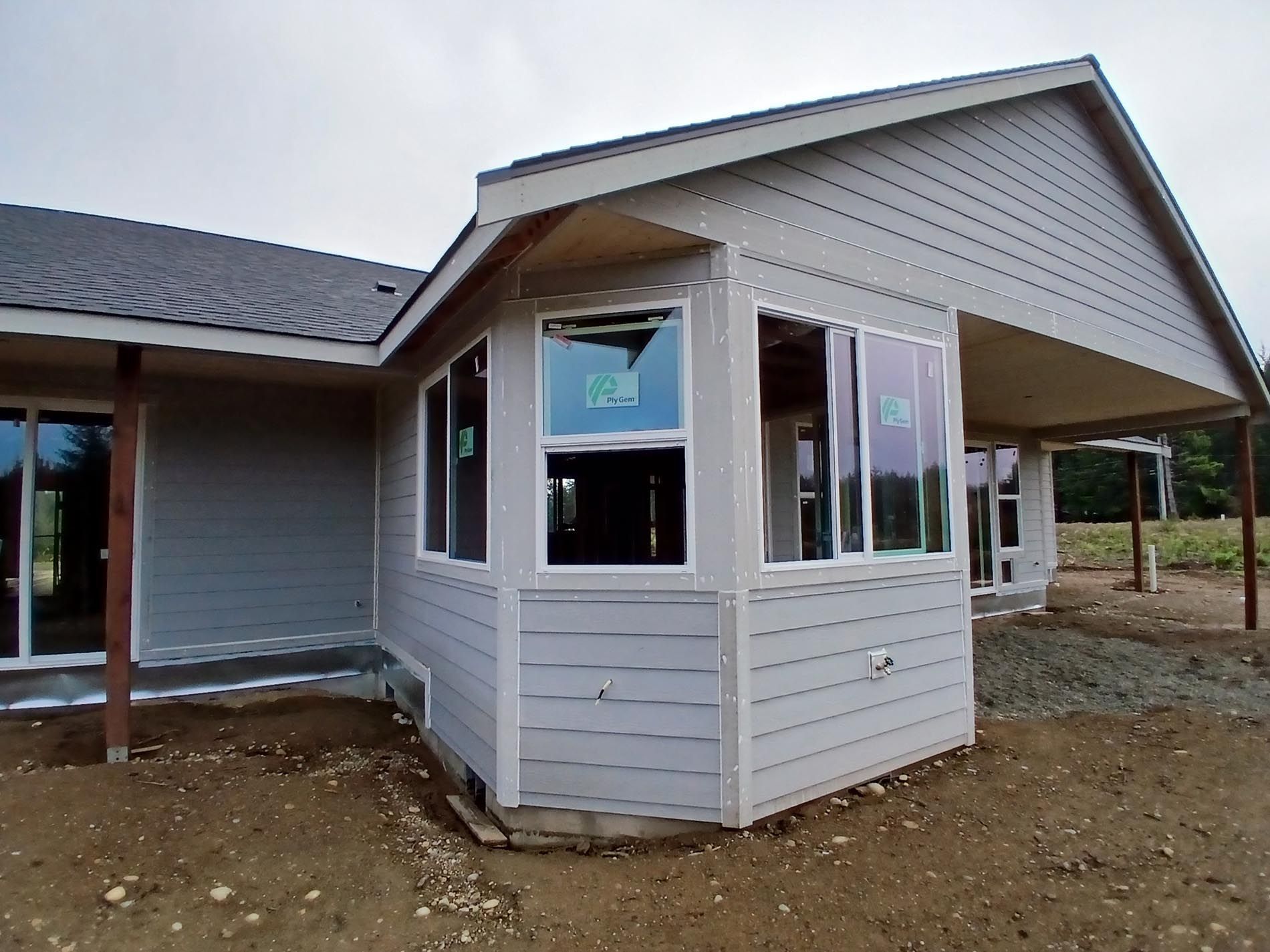 A house with a lot of windows is being built