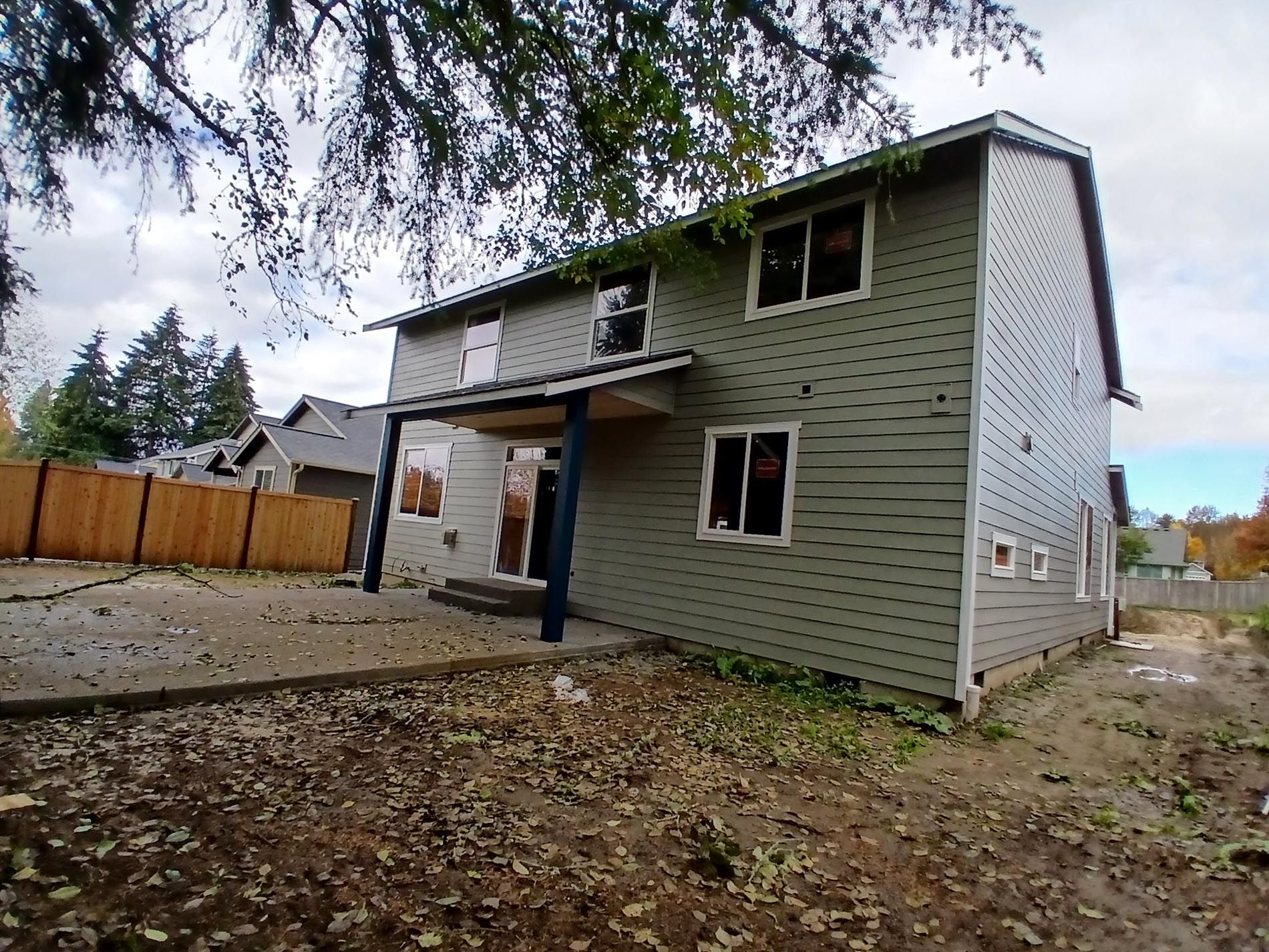 A house with a wooden fence in front of it