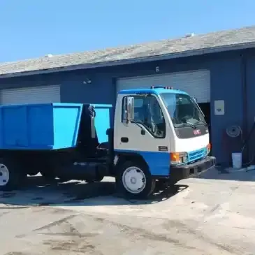 Big Blue Dumpster Truck — Bradenton, FL — Flying Dutchman Dumpsters