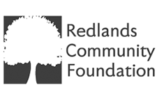 A logo for the redlands community foundation with a tree in the middle.