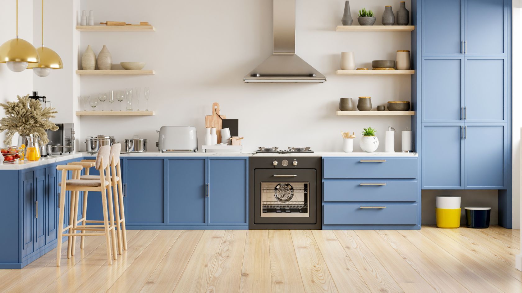 Blue and white kitchen with wooden floors and open shelving.  Features oven, cabinets, counter with bar stools, and appliances.