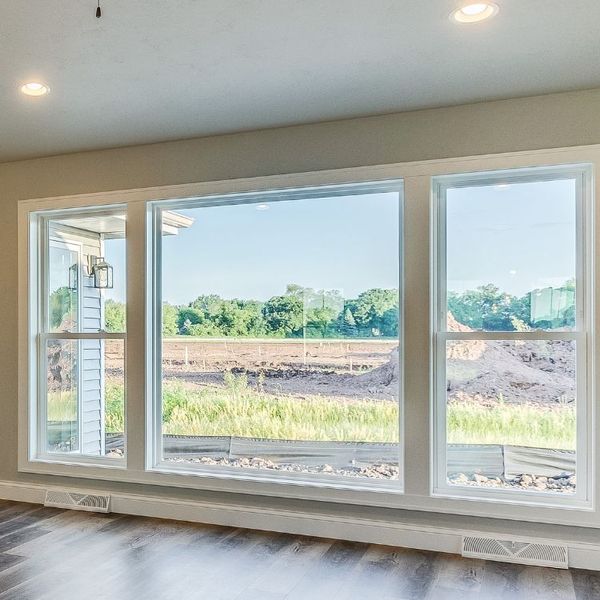 Interior view of large windows with a scenic outdoor view.