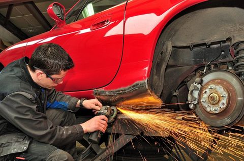a mechanic offering car welding services