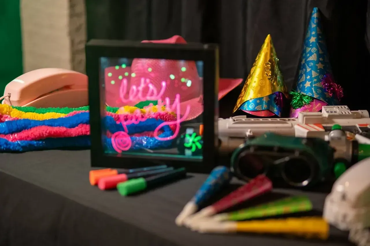 A table with a picture on it that says let 's party