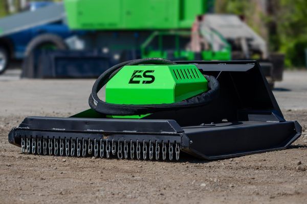 A green and black machine with the word es on it