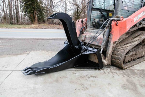 A black bucket with a hose attached to it