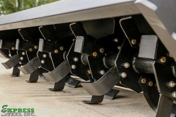 An express steel inc. logo is on the side of a concrete surface