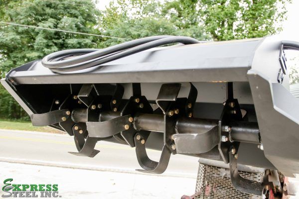 A black machine with express steel inc. written on the bottom