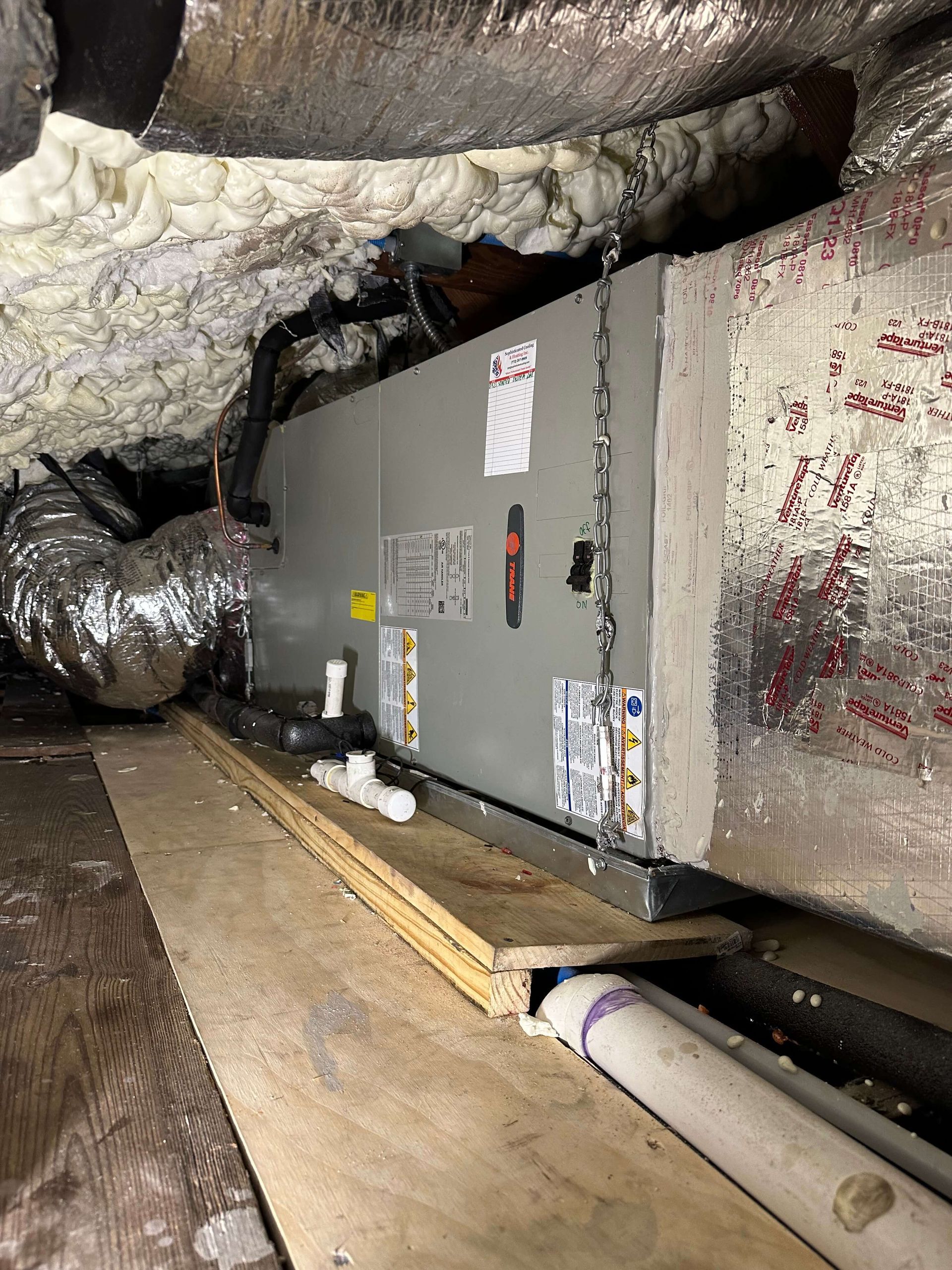 A picture of an air conditioner in a basement.