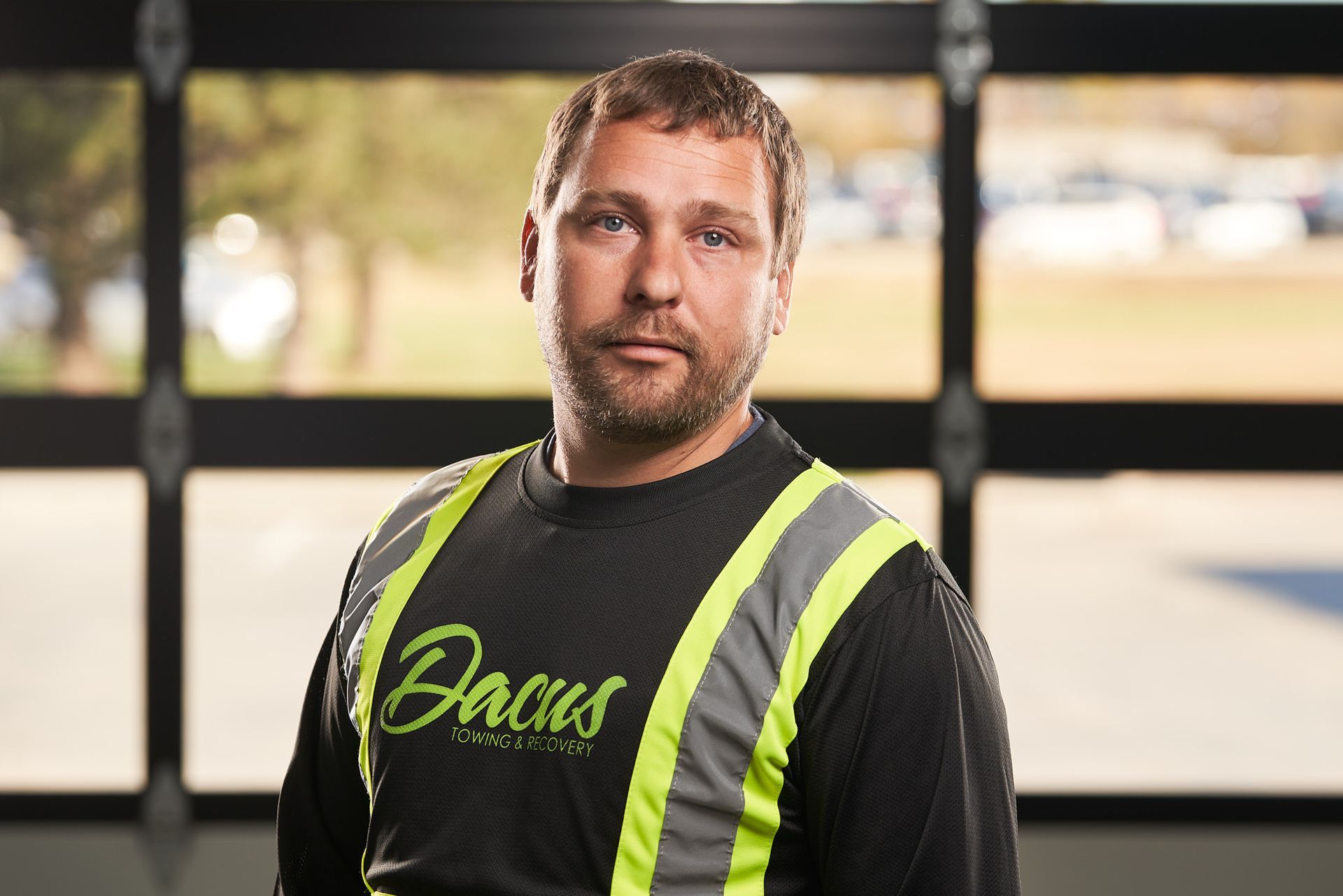 Woman with blonde and pink hair wearing glasses and a black shirt.