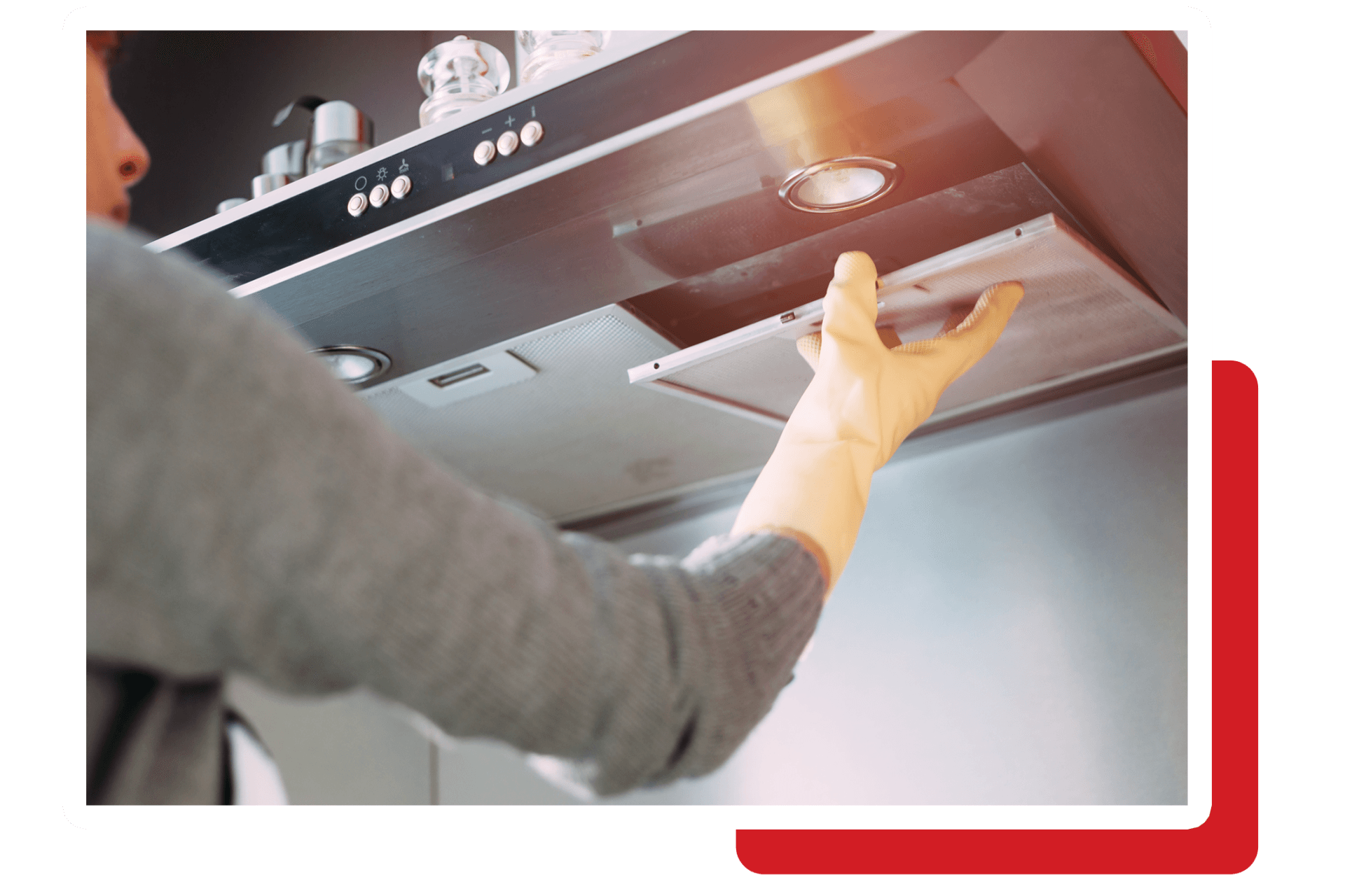 Close Up of Woman Removing Dirty Filter from Kitchen Hood — Brisbane, QLD — Rangehood Installation and Ducting Services Pty Ltd