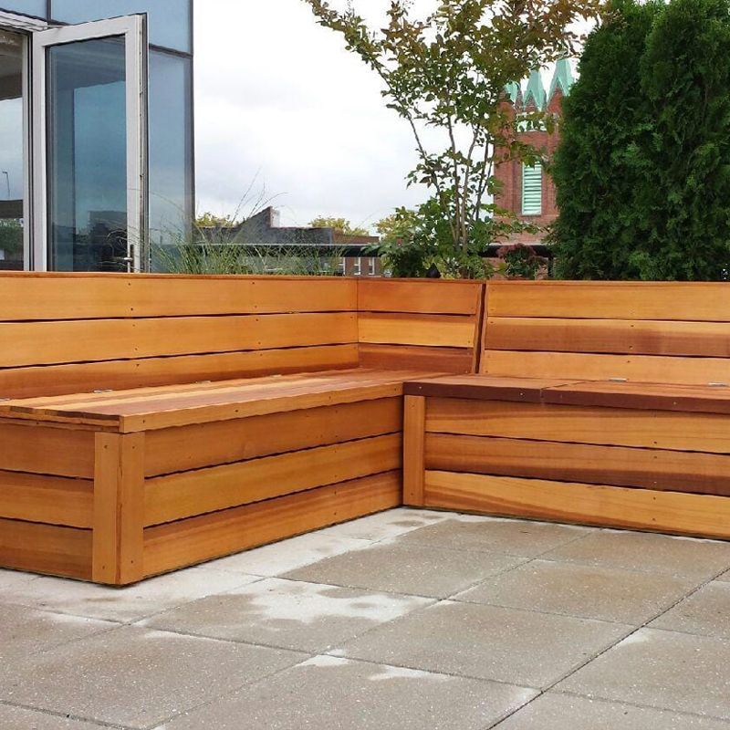 L-shaped wooden bench on a patio