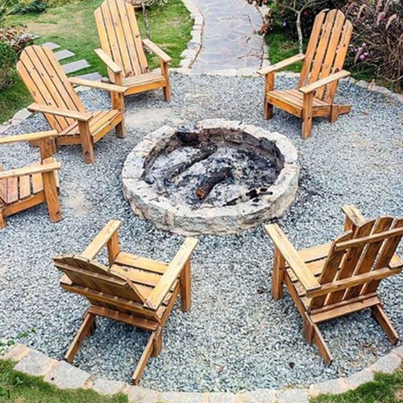 Outdoor patio with black pergola, white walls, wood deck, and pool