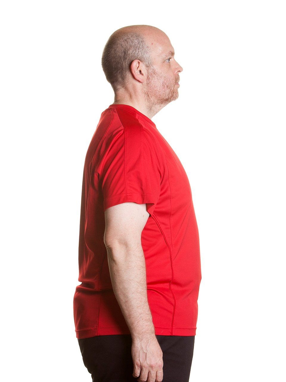 a man in a red shirt is standing in front of a white background